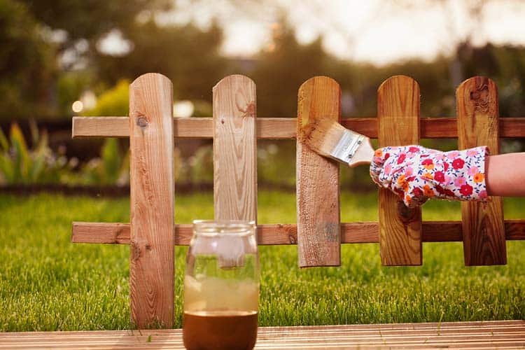 varnishing-the fence