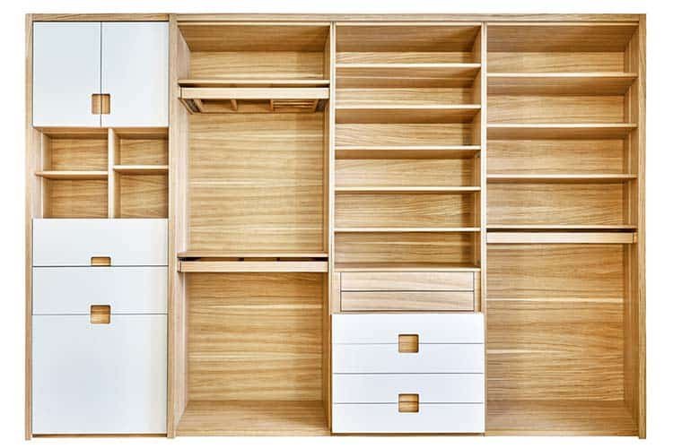 Modern wardrobe with empty shelves isolated on white background. Wooden wardrobe with light gray cabinet doors