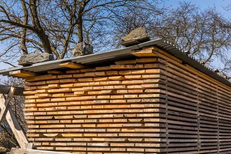 Wooden planks and beams. Air-drying timber stack. Wood air dryin