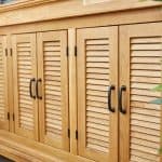 Large wooden chest of drawers made of acacia wood. Close-up.