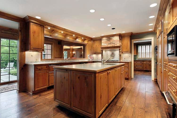 Traditional kitchen in luxury home with oak wood cabinetry